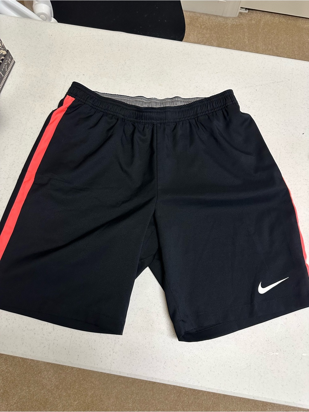 Nike Black Athletic Shorts with Coral Side Stripe